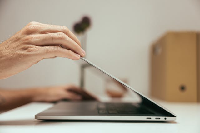 person%20opening%20a%20laptop.
